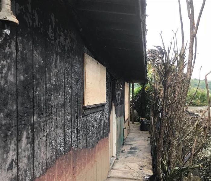 exterior wall of home charred black