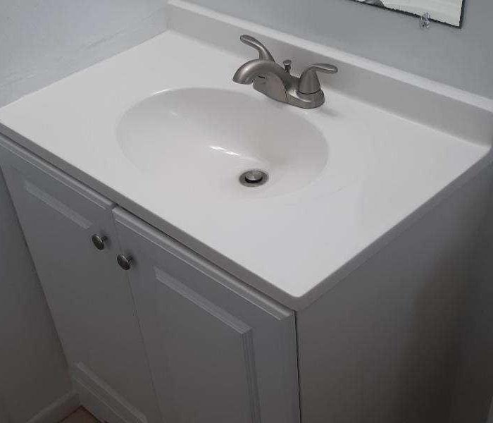 New white sink counter in bathroom