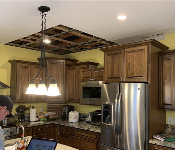 kitchen with a large section of the ceiling cut out