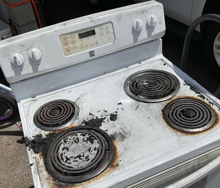 Burnt and damaged stovetop that caught on fire in a Central Honolulu home.